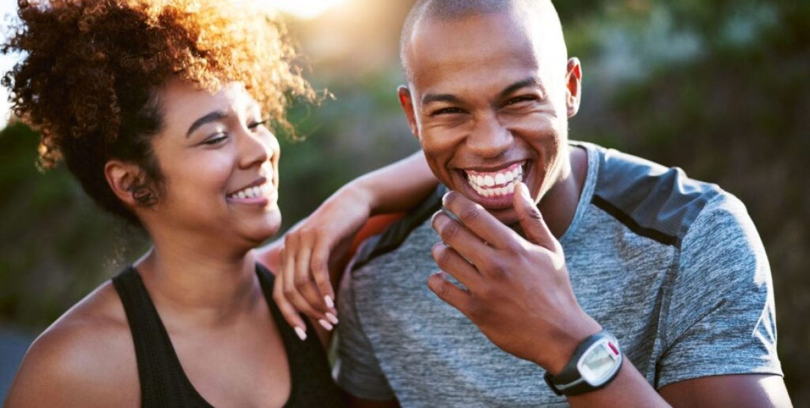 young-african-american-couple-walking-together-outside-while-smiling-1024x576